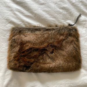 Faux fur clutch can fit Size of big IPad